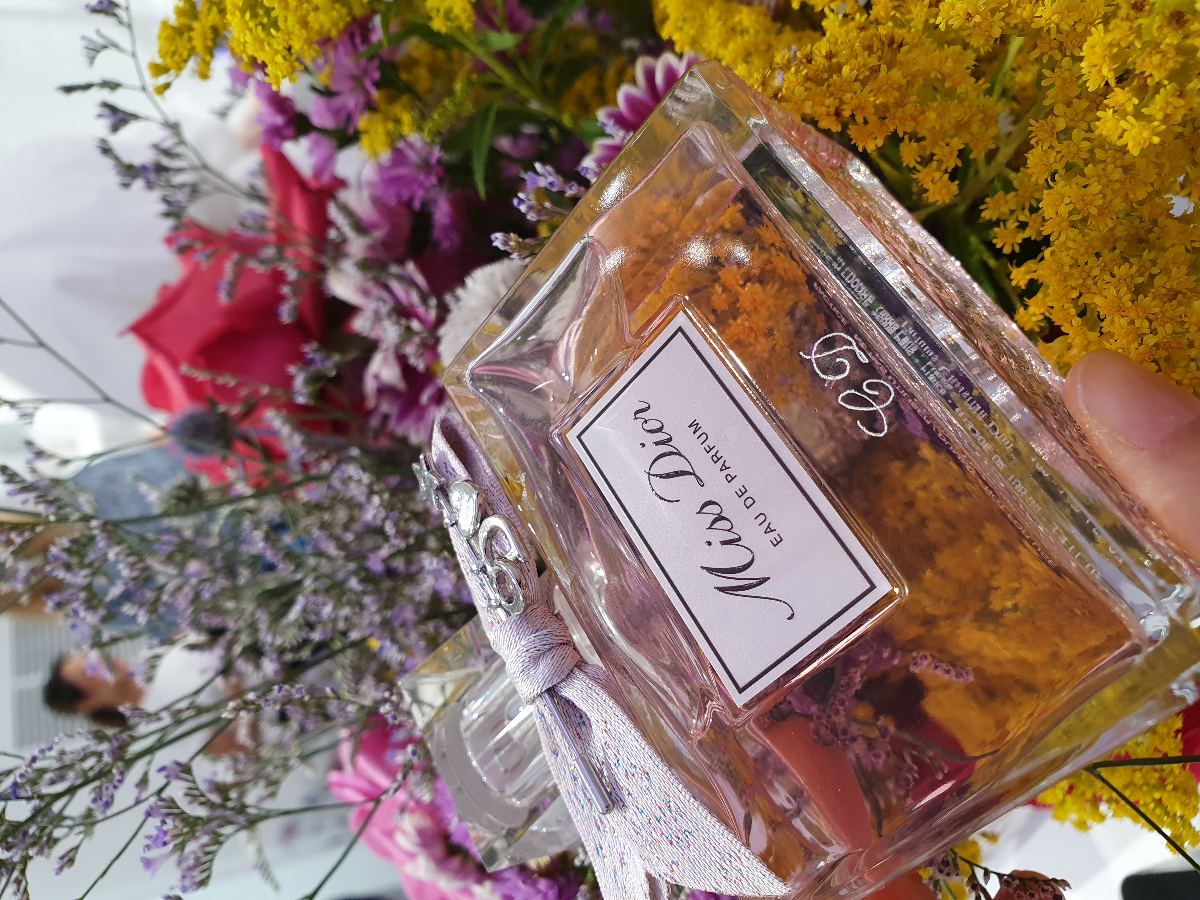 Hand-engraved initials on fragrances