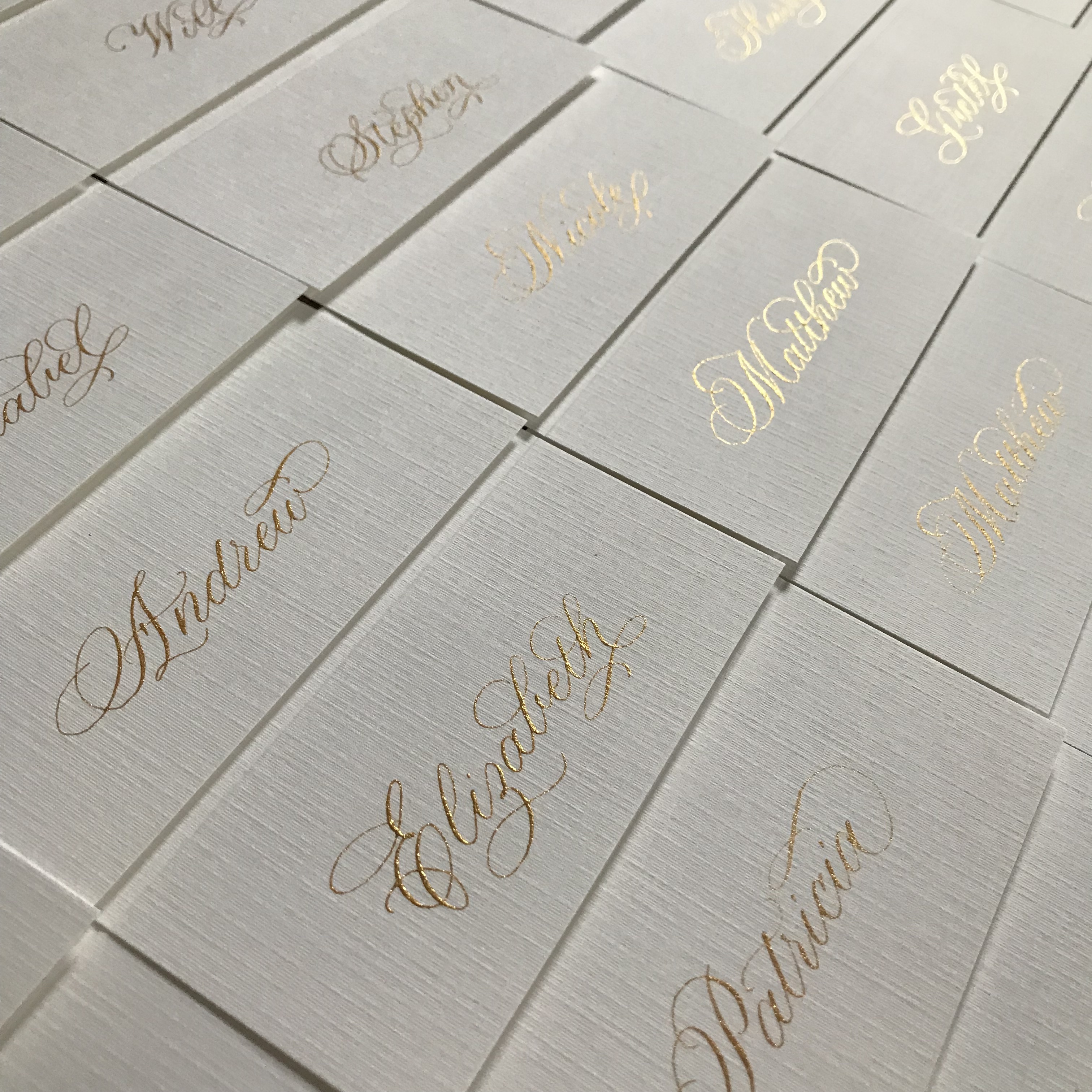 Flourished calligraphy on textured cards